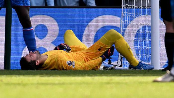 Alisson lays injured during the win against Crystal Palace