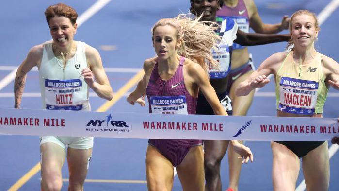 Georgia Bell crosses the finish line and wins in the mile women event at the 117th Millrose Games