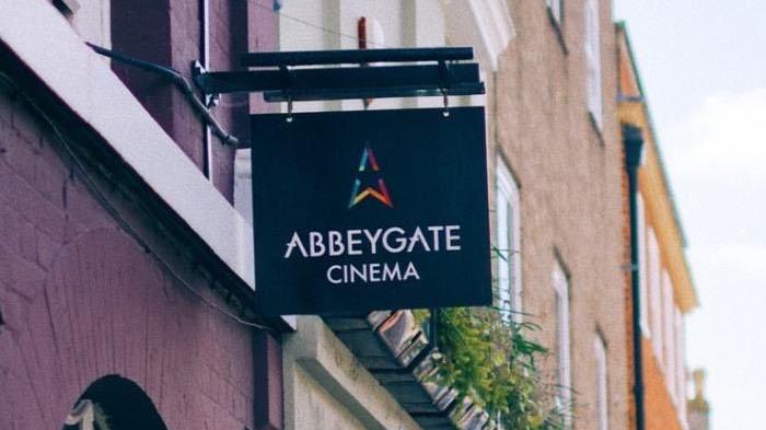 A close up of the Abbeygate Cinema sign above its entrance. 