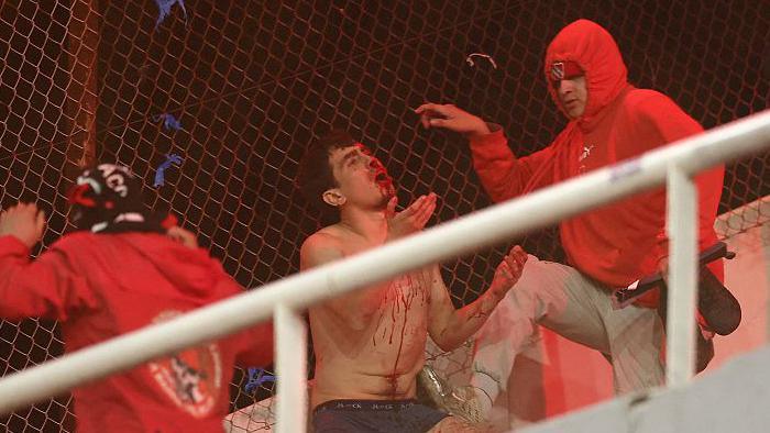 A Universidad de Chile fan being attacked by a rival fans during the team's Copa Sudamericana match away to Independiente in August 2025