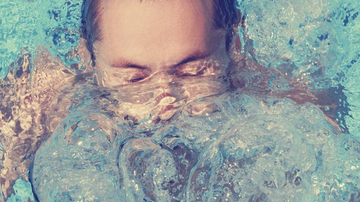 A person swimming underwater