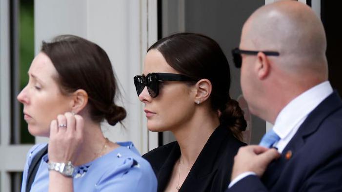 Naomi Biden (C), daughter of Hunter Biden, leaves the J. Caleb Boggs Federal Building on June 07, 2024