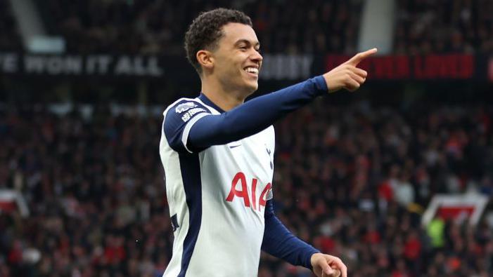 Brennan Johnson celebrates giving Tottenham an early lead at Manchester United