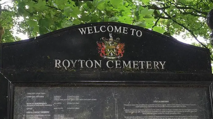 A shot of the black sign at Royton Cemetery