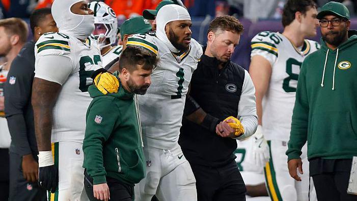Micah Parsons is helped off the field after a suspected ACL injury playing for the Packers