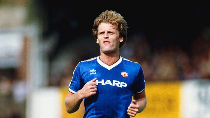 Footballer Gordon McQueen looks on while playing for Manchester United