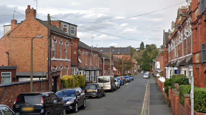 Southfield Street in Worcester with parked cars down one side of the road and red brick houses