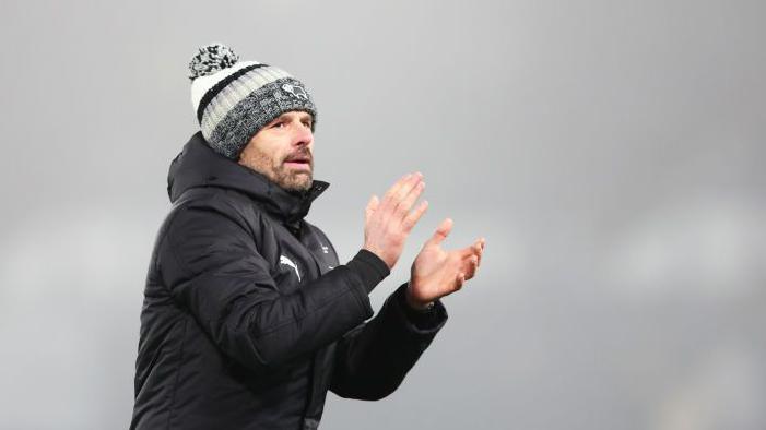 Derby boss Paul Warne claps the fans following his side's win over West Bromwich Albion