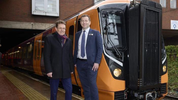 Andy Street and Ian McConnell in front of a train