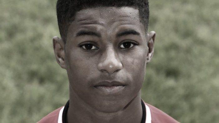 Marcus Rashford posts for under 18s team picture in 2014