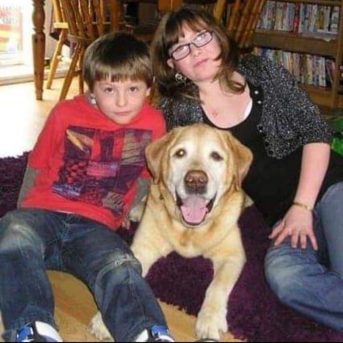 Callum with his mum and dog when he was younger