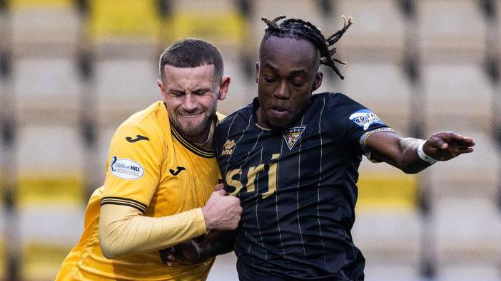 Livingston's Reece McAlear and Dunfermline's Ewan Otoo in action during a William Hill Championship match between Livingston and Dunfermline Athletic at the Home of the Set Fare Arena, on February 15, 2025, in Livingston, Scotland. (Photo by Mark Scates / SNS Group)