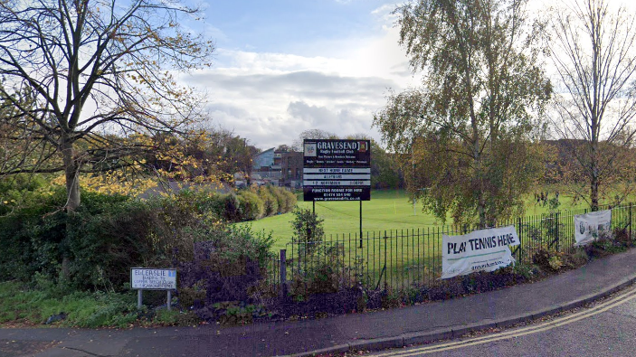 A google street view of a sign on a field which says Gravesend Rugby Club on