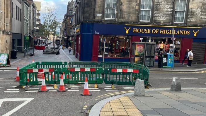 Barriers around sinkhole on Bridge Street