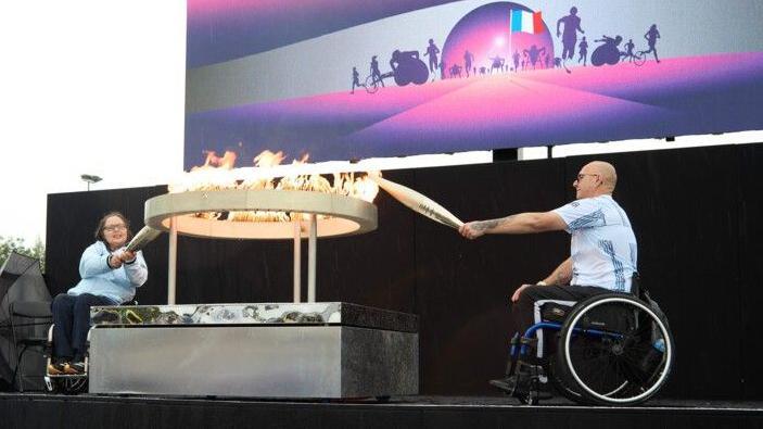 Helene Raynsford and Gregor Ewan light the Paralympic flame