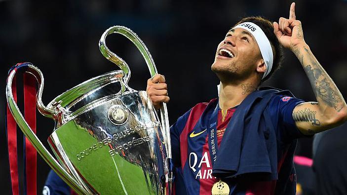 Neymar holds the Champions League trophy