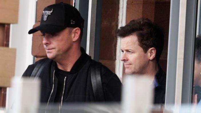 BGT Presenters Ant McPartlin (left) and Declan Donnelly (Ant and Dec) leave The Grand Hotel in Lytham Saint Annes, Lancashire, after Britain's Got Talent announces it is postponing auditions for the show.