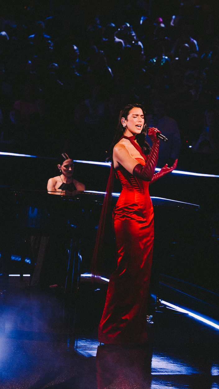 Dua Lipa performs in a red John Paul Gaultier dress at the Royal Albert Hall