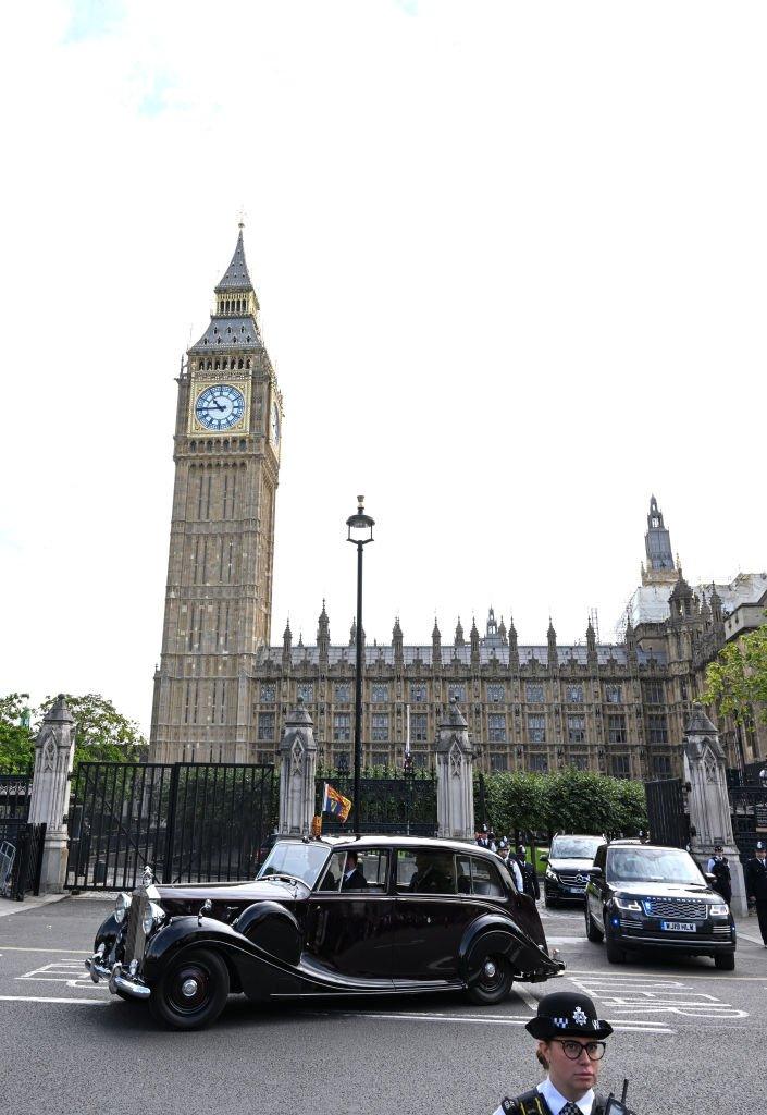 King Charles III and Camilla, Queen Consort are seen departing the Houses of Parliament