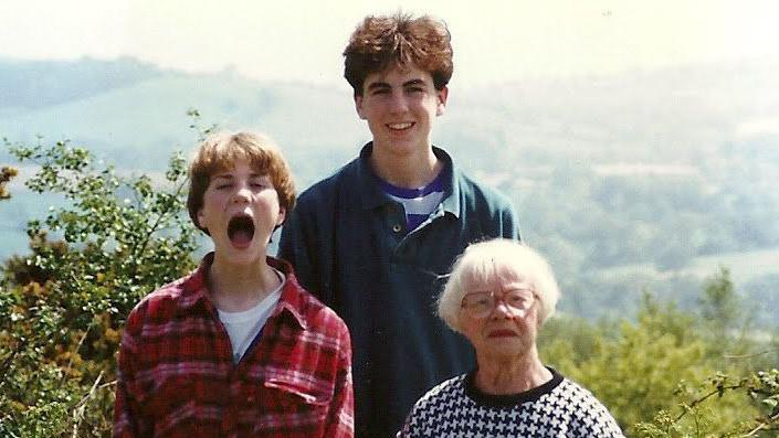 Ms Herriot with Mr Holland and his sister Alexandra in the 1990s