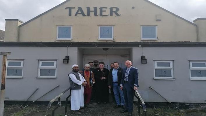 Rob Waltham and members of the community outside what will be the centre