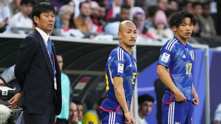 Japan head coach Hajime Moriyasu and Celtic's Daizen Maeda and Reo Hatate