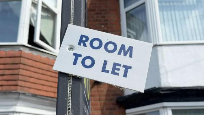 A white to let sign with blue letters