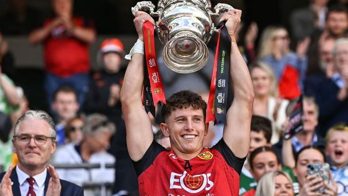 Down captain Pierce Laverty lifts the Tailteann Cup at Croke Park