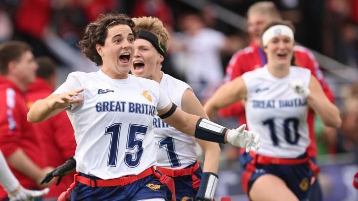 Emily Kemp and her team-mates celebrate after Great Britain beat Austria in the women's final of the 2025 European Flag Football Championships