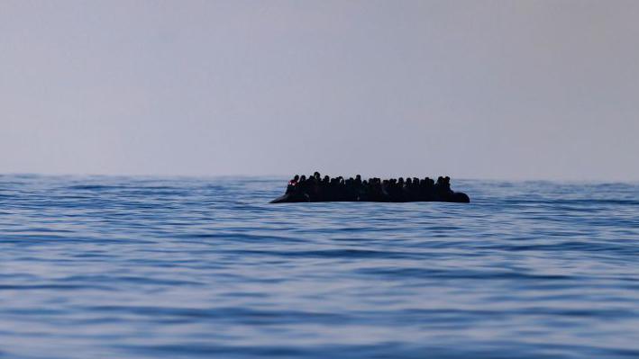 A inflatable dinghy carrying around 65 migrants crossing the English Channel