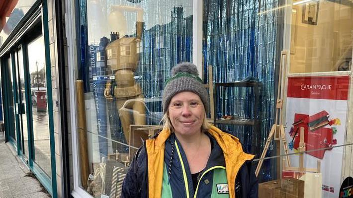 Georgina Wilson-Powell from the Don't Miss Margate newsletter stands outside an artists shop on Northdown Road in Cliftonville