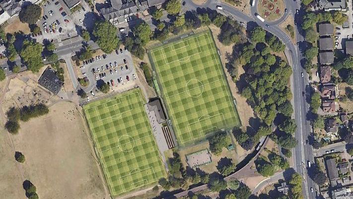 A bird's-eye view of two football pitches