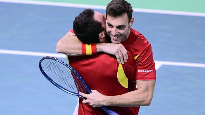 Marcel Granollers and Pedro Martinez hug after winning their doubles match