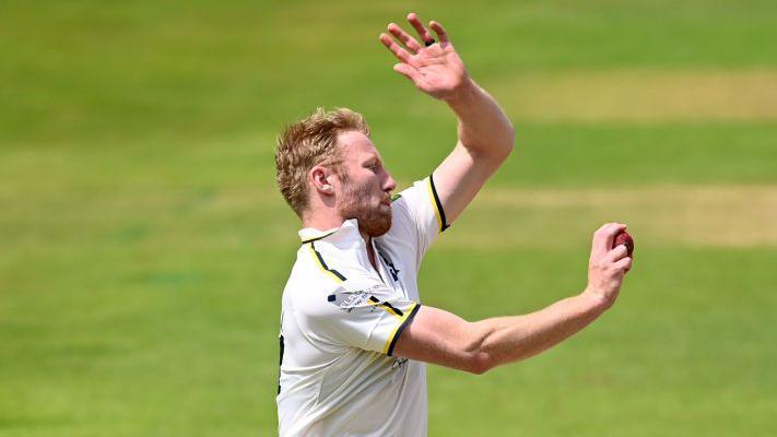 Liam Norwell in his delivery strike for Warwickshire