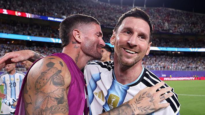 Rodrigo de Paul celebrating with Lionel Messi for Argentina