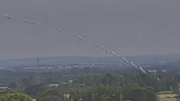 A blurry image with an aircraft possible to make out. It is pictured at multiple moments in its descent, as the angle it travels steepens significantly.