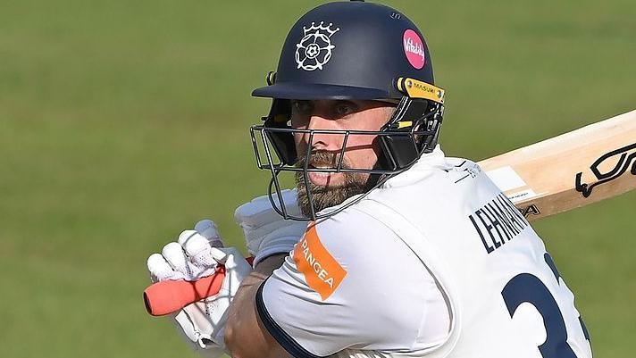Jake Lehmann swishes his bat behind his right shoulder