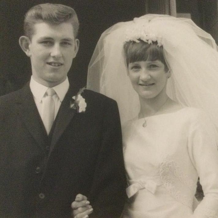 Black and white wedding photo of Bill and Aileen Turnbull in 1967, Bill in smart dark suit and Aileen in white gown