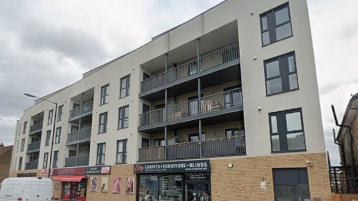 A general view picture of Grand Union House, which is a four-storey building with shops on the ground floor