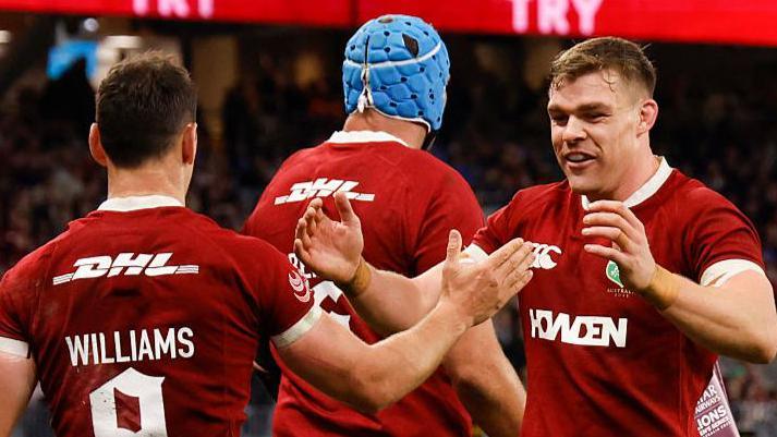 Lions players celebrate