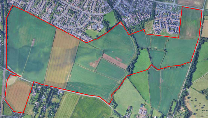 A red line on an aerial view of the proposed site
