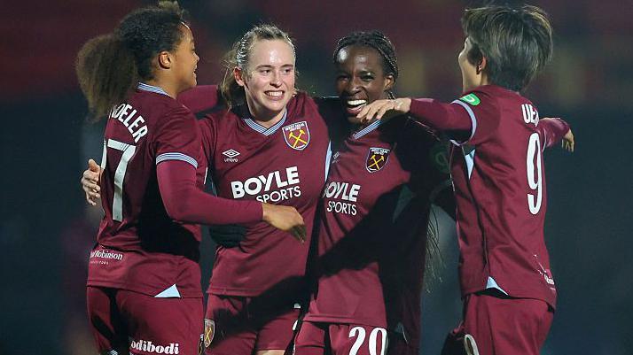 Viviane Asseyi celebrates with her West Ham team-mates 