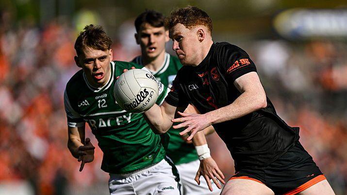Conor Turbitt runs at the Fermanagh defence