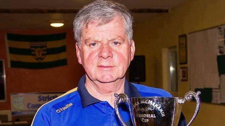 Michael McMenamin with the Maurice McMenamin Memorial Cup which is an annual running event that takes place at the club