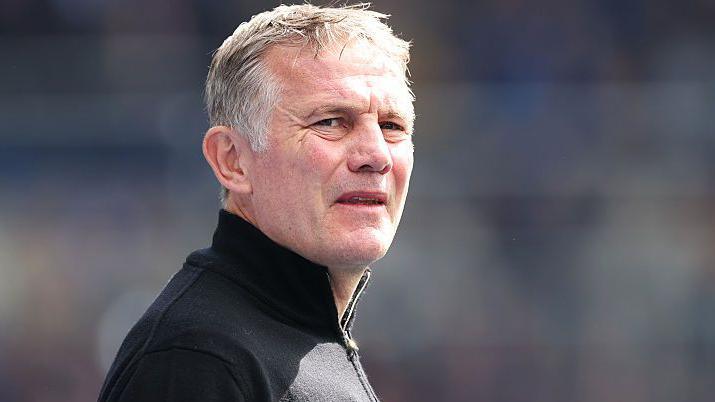 Wrexham manager Phil Parkinson watches them at Birmingham City