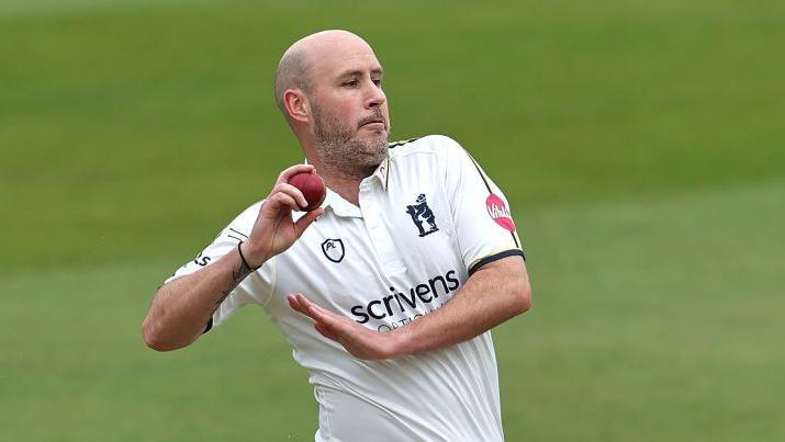 Chris Rushworth ready to release the ball in his bowling action for Warwickshire