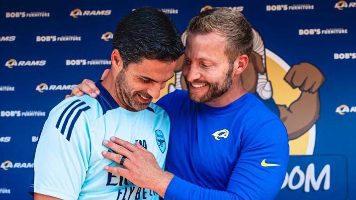 Arsenal manager Mikel Arteta chats with Los Angeles Rams head coach Sean McVay at a youth football clinic at the Rams' training camp in July 2024