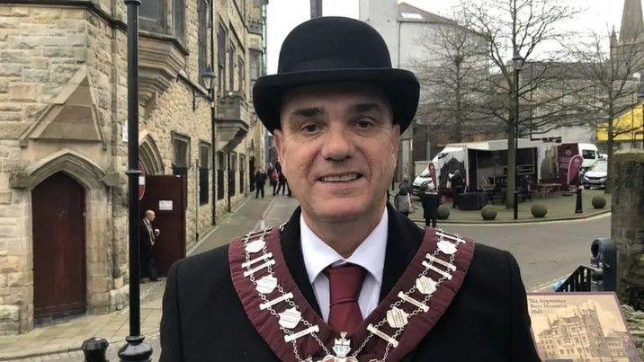 Graeme Stenhouse in a bowler hat and suit pictured at a previous Apprentice Boys event. 