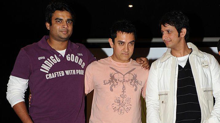 The cast of Indian Bollywood film "Three Idiots" Aamir Khan (C), R. Madhavan (L) and Sharman Joshi (R) pose for a photograph at the City Pulse Multiplex in Gandhinagar, some 30 kms. from Ahmedabad on January 3, 2010. AFP PHOTO/ Sam PANTHAKY (Photo credit should read SAM PANTHAKY/AFP via Getty Images)
