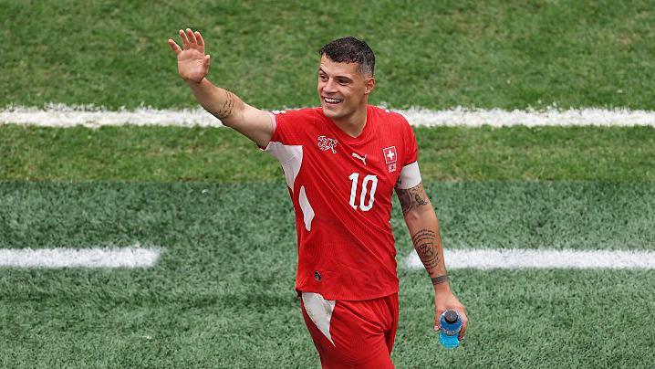 Granit Xhaka waves to the crowd 